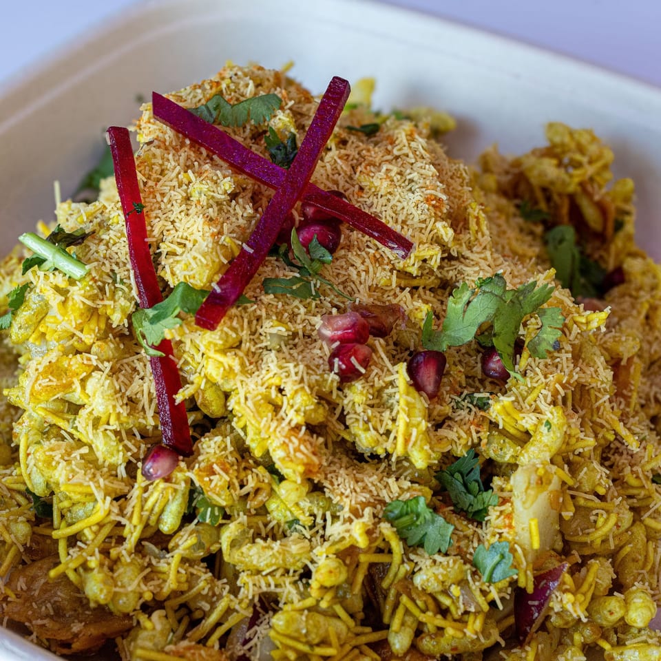 Chaat topped with sev and pomegranate